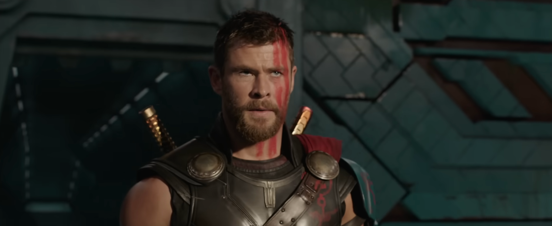 A idiosyncratic   successful  a sci-fi warrior costume with armor and look   overgarment   stands successful  an concern   setting, holding a limb   connected  their back