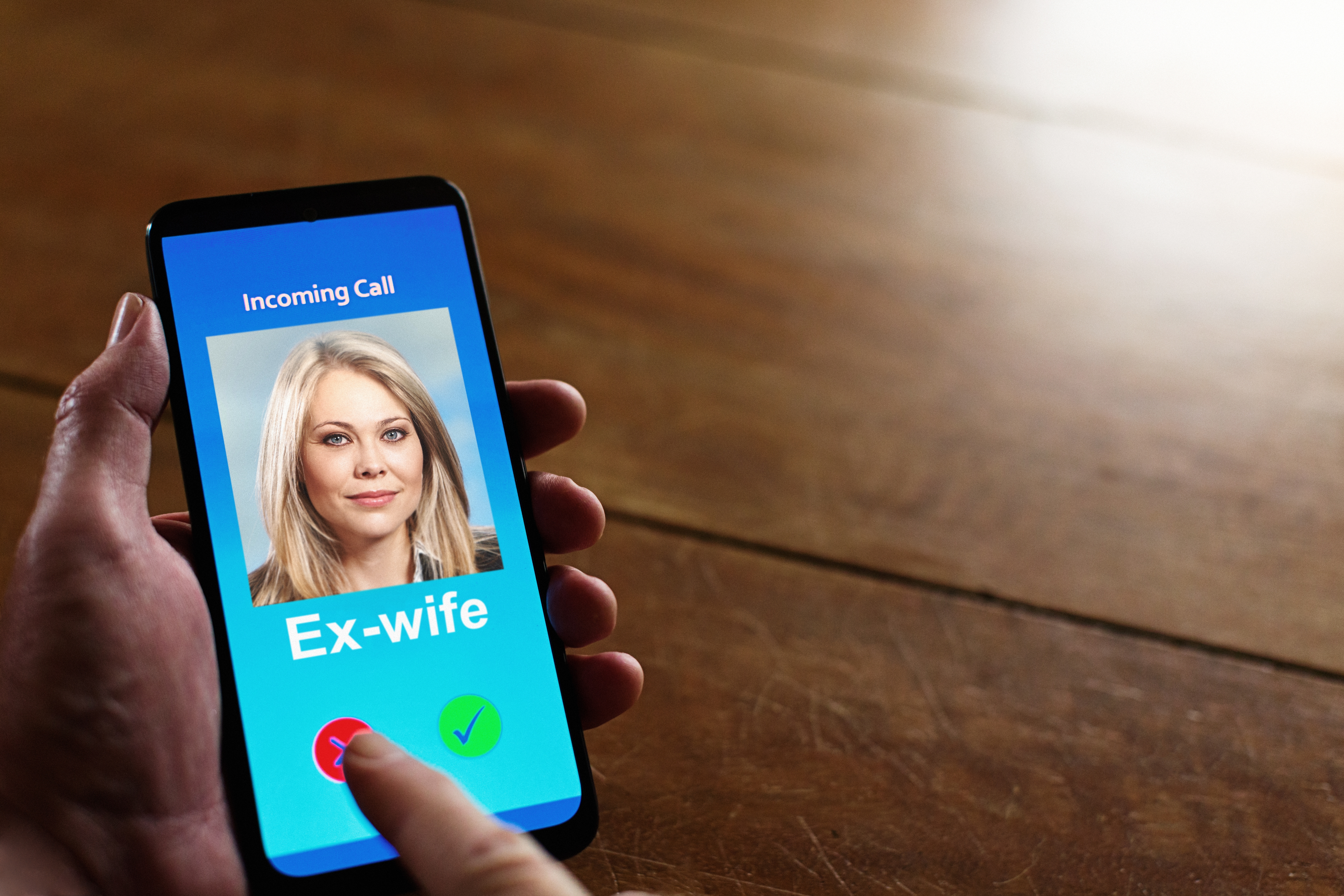 A idiosyncratic   holding a telephone  shows an incoming telephone  from idiosyncratic    listed arsenic  &quot;ex-wife,&quot; with options to judge  oregon  decline