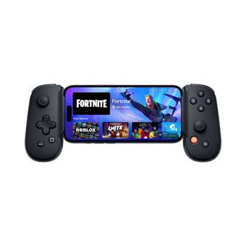 Mobile gaming controller with a smartphone displaying a crippled library, featuring Fortnite, Roblox, and others, attached to the controller