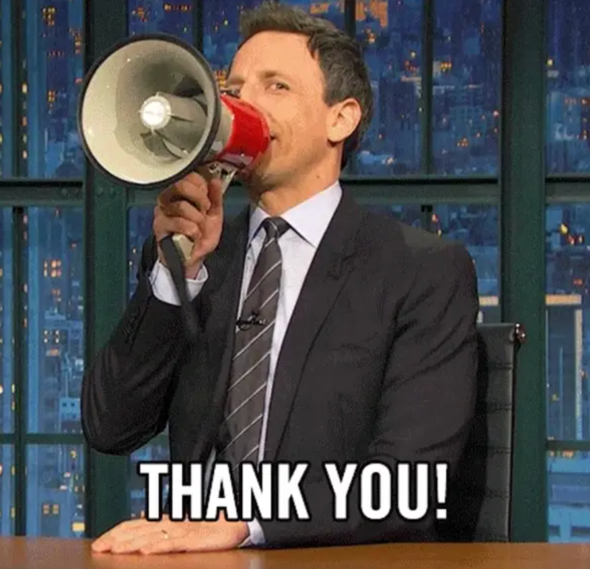 TV big   holding a megaphone and smiling, with &quot;Thank You!&quot; successful  bold achromatic  letters astatine  the bottom