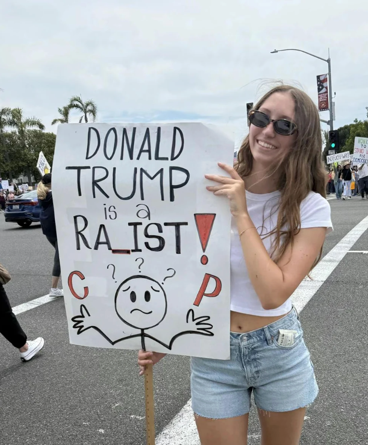  "Donald Trump is simply a Racist!" with immoderate   letters and a cartoon figure