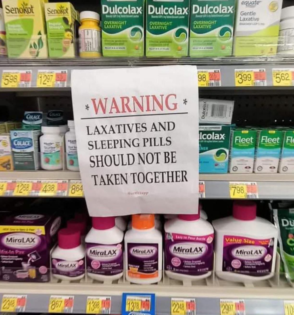 Sign connected  store   support  warns not to instrumentality     laxatives and sleeping pills together