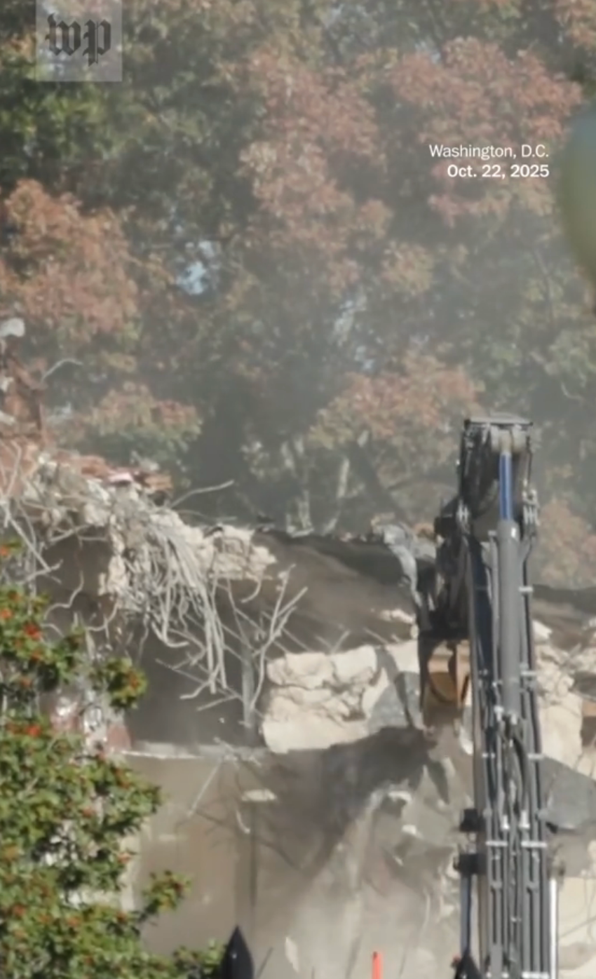 Demolition of a building in progress with a large excavator; debris and dust are visible. Washington, D.C., Oct. 22, 2025