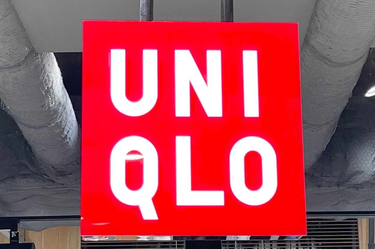 UNI QLO store interior with clothing displays and overhead signage