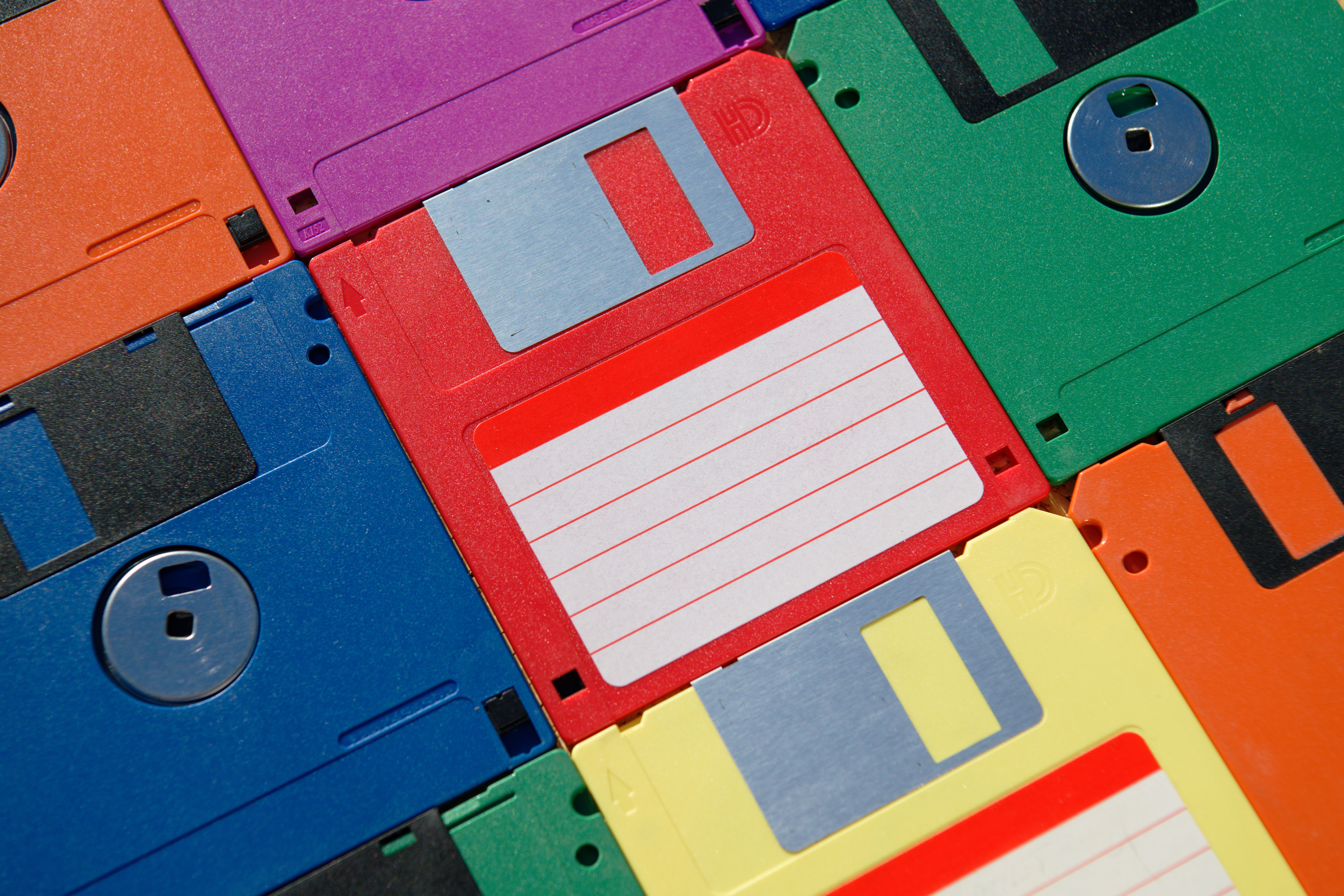 Stack of colorful floppy disks arranged intimately  together