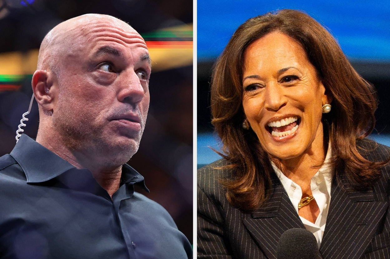 Two individuals, one in a dark shirt with an earpiece, the other in a pinstripe suit, smiling and speaking at an event