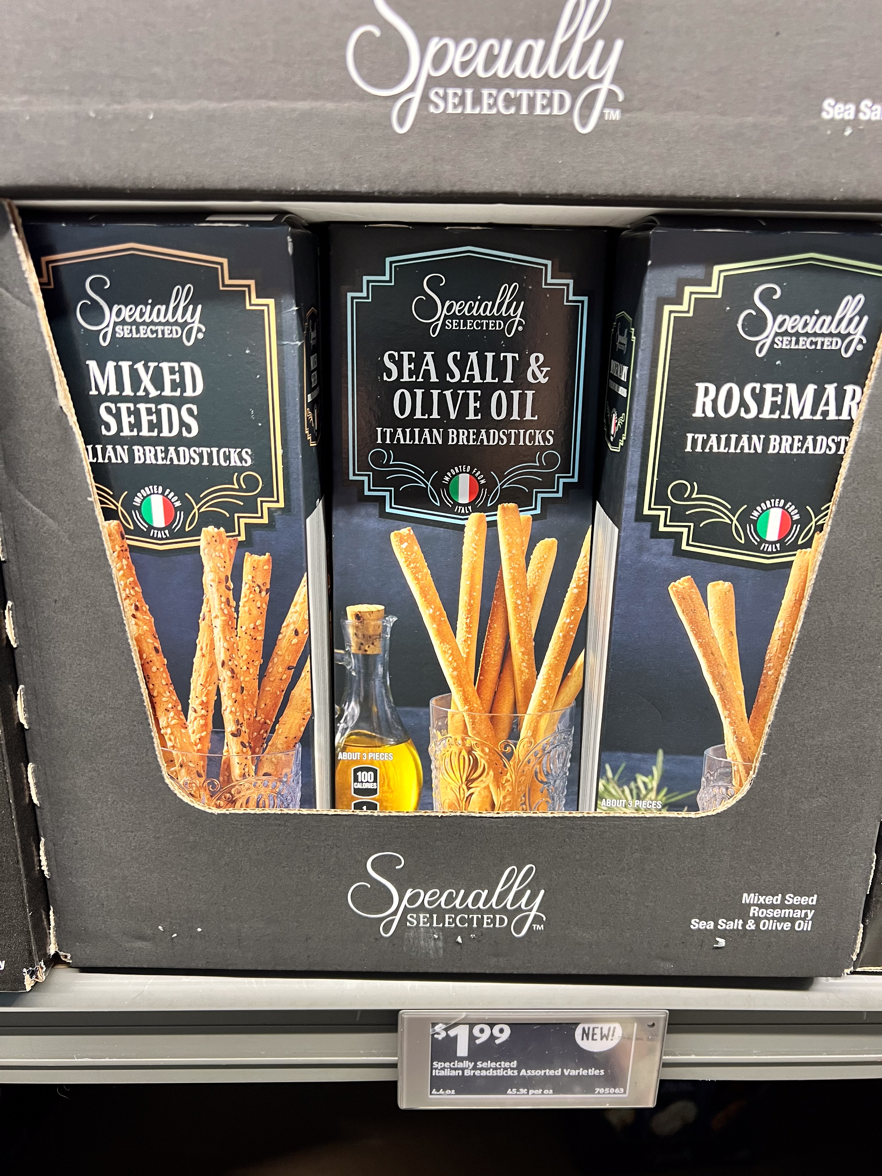 Three boxes of &quot;Specially Selected&quot; Italian breadsticks: Mixed Seeds, Sea Salt &amp;amp; Olive Oil, and Rosemary, priced at $1.99 each