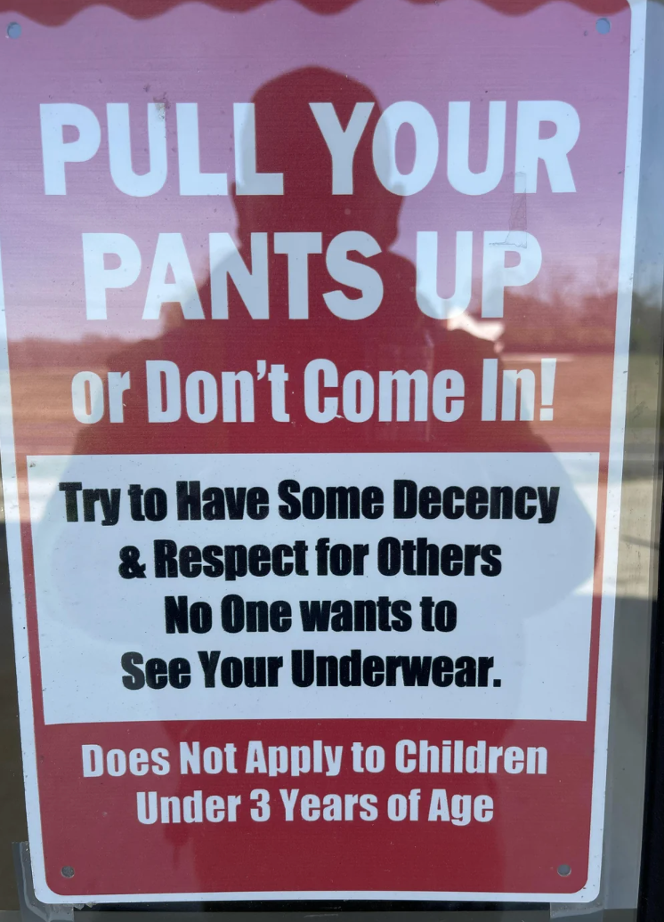 Sign saying "Pull your pants up   oregon  don't travel  in! Respect others; nary  1  wants to spot    your underwear. Excludes kids nether  3."