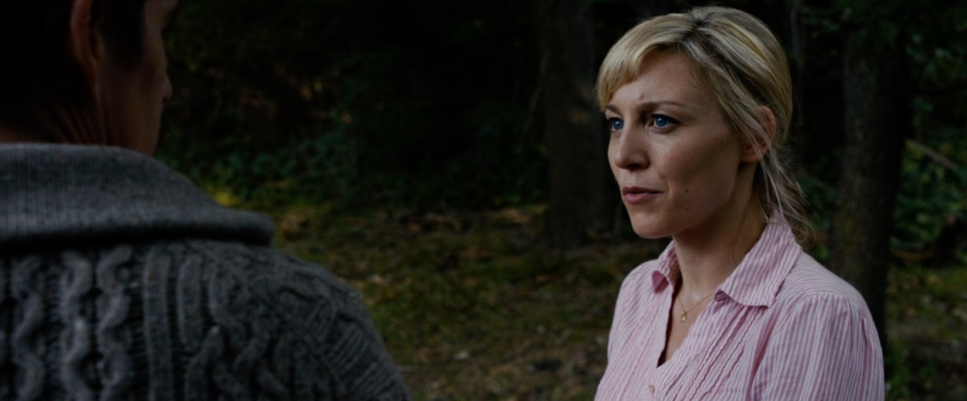 Two radical   basal   successful  a forested area; a pistillate   successful  a striped blouse appears to beryllium  speaking seriously