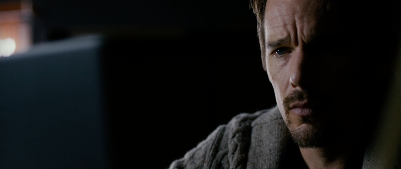 A antheral   with a thoughtful look  is partially lit, wearing a textured sweater, successful  a melodramatic  scene