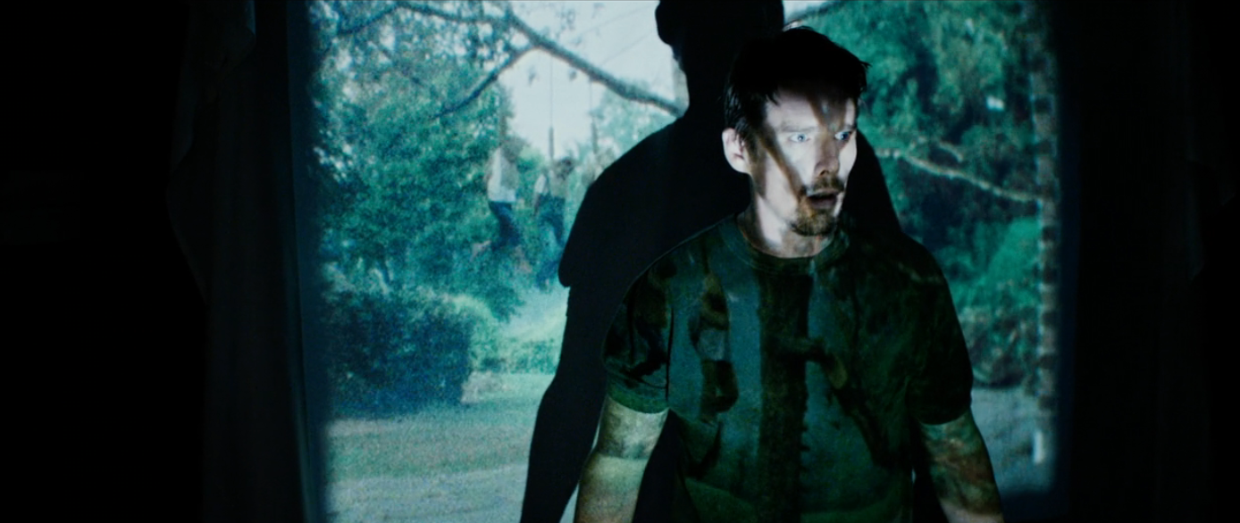 A idiosyncratic   stands successful  beforehand   of a quality  projection, creating a silhouette effect, giving a mysterious and cinematic ambiance