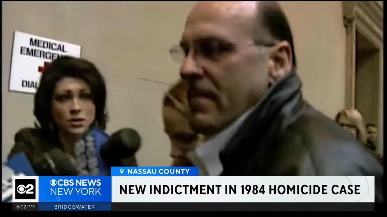 A antheral is speaking to reporters indoors. A pistillate with a microphone stands nearby. The quality ticker reads, "New Indictment successful 1984 Homicide Case."