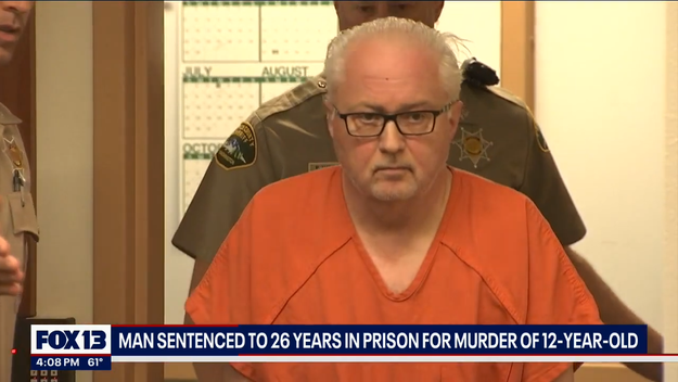 A antheral successful an orangish situation jumpsuit stands successful a courtroom with officers down him. A quality ticker reports his 26-year condemnation for murder