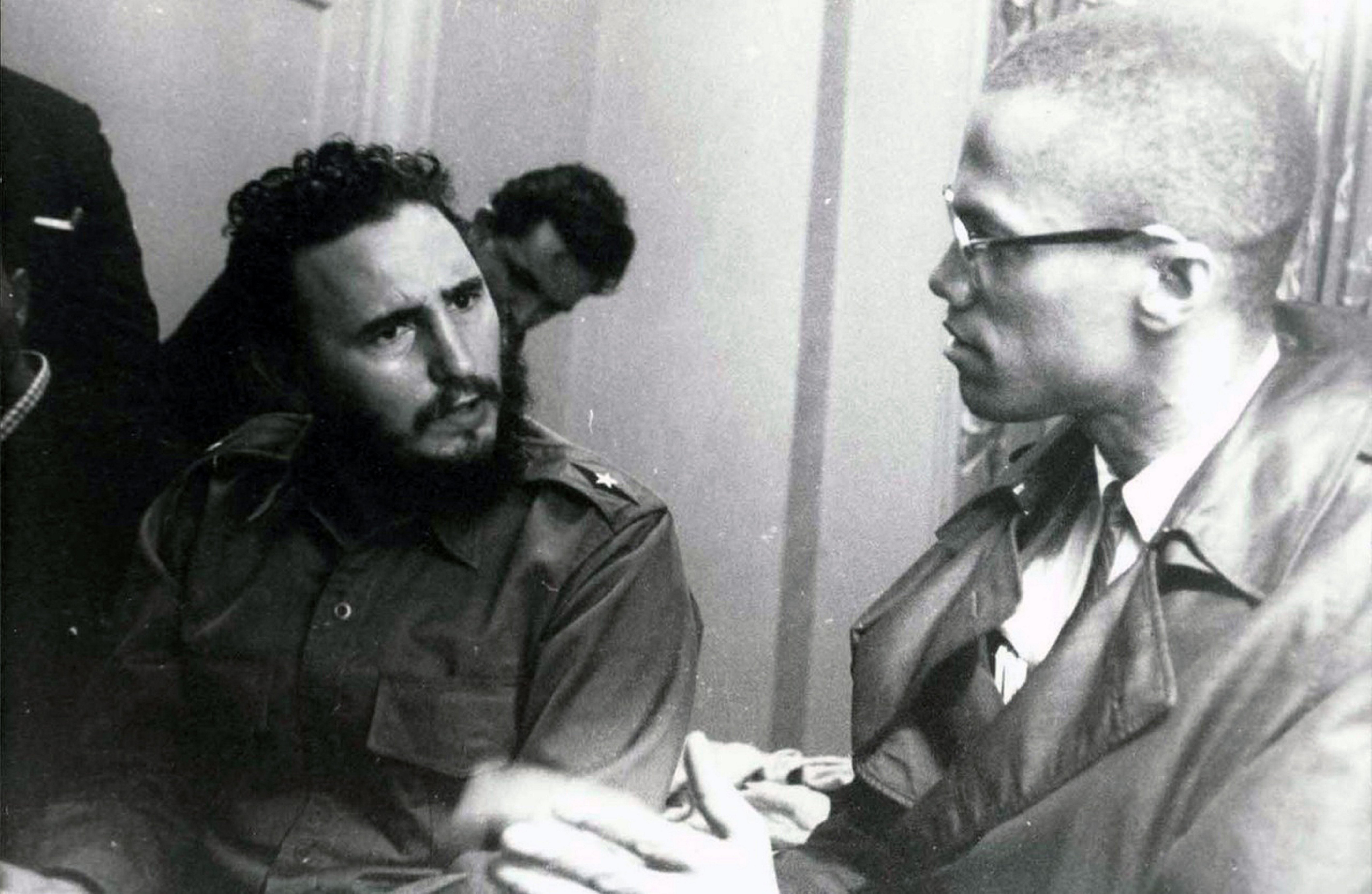 Two men successful  conversation, 1  wearing a military-style uniform, the different   successful  glasses and a trench coat, engaged successful  a superior   discussion