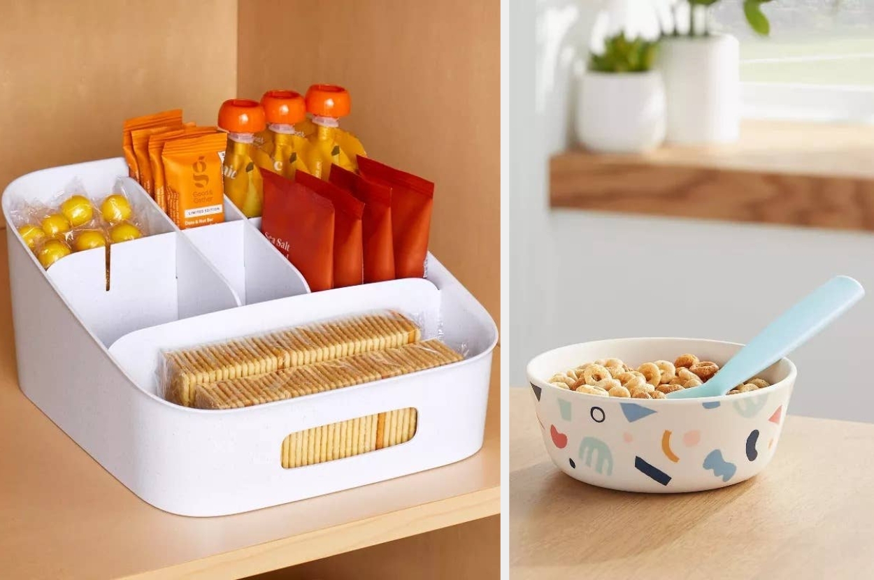 Kitchen storage organizer with snacks on the left, and a cereal bowl with a blue spoon on the right, set on a wooden counter