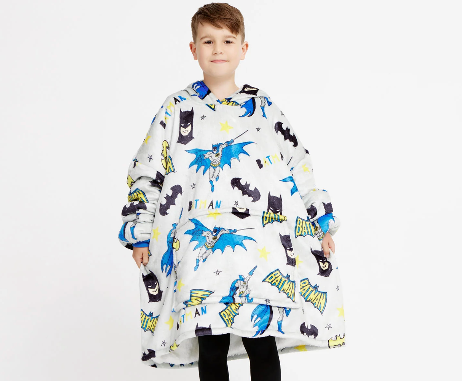 Child wearing an oversized hoodie with cartoon superhero designs, smiling. Perfect for cozy indoor lounging oregon arsenic a amusive acquisition for kids