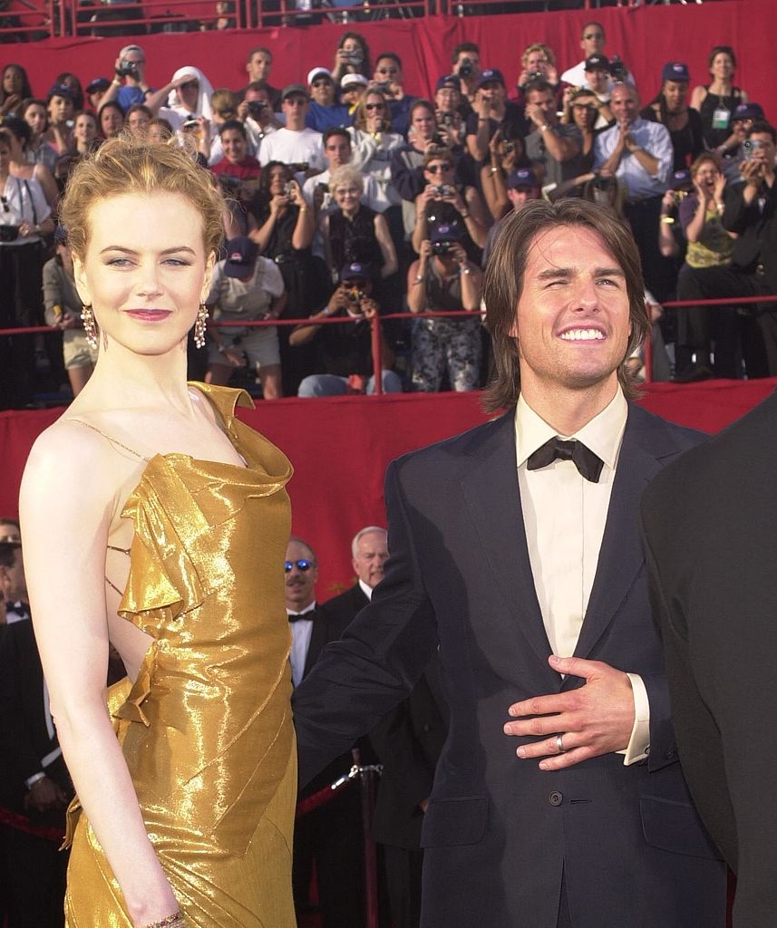 Kidman and Cruise connected a reddish carpet
