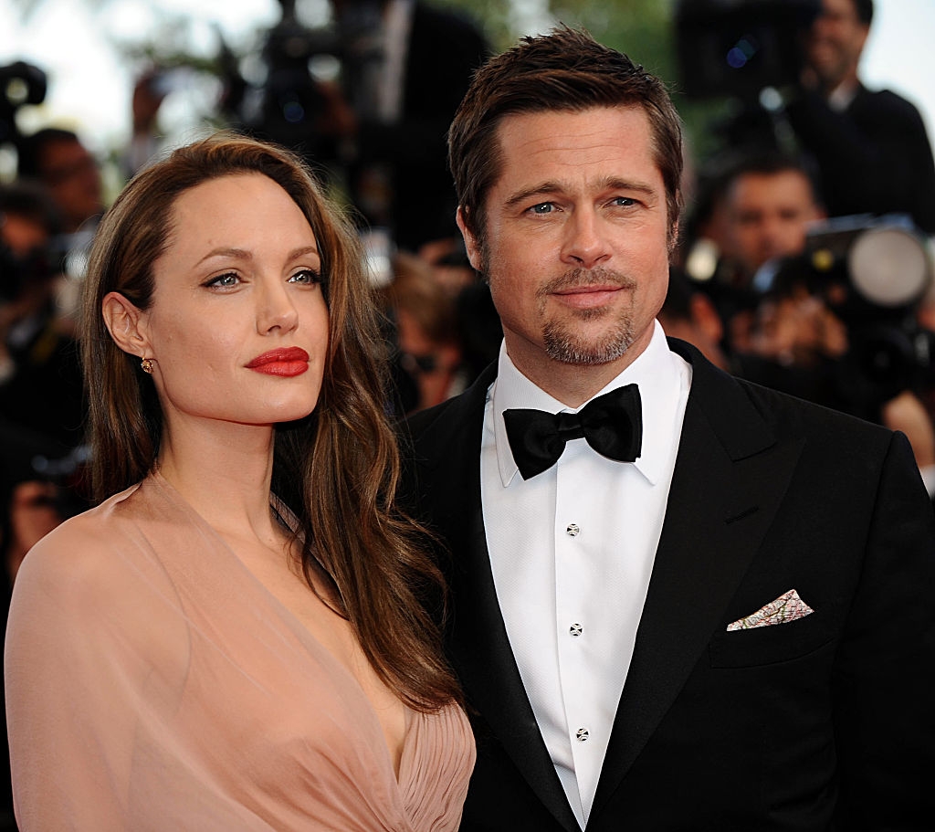 Angelina and Brad connected a reddish carpet