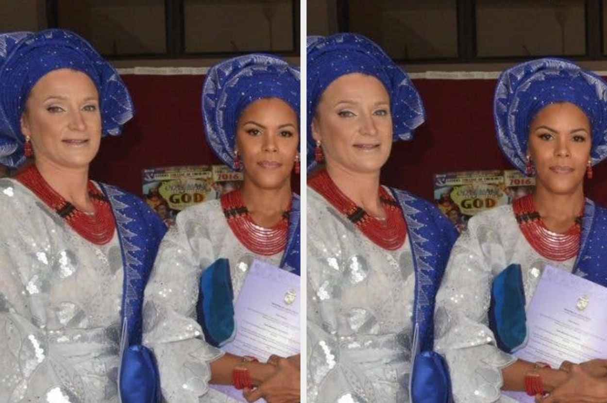 Two individuals wear elegant traditional attire with headwraps and red beaded jewelry, holding documents, standing before a red background