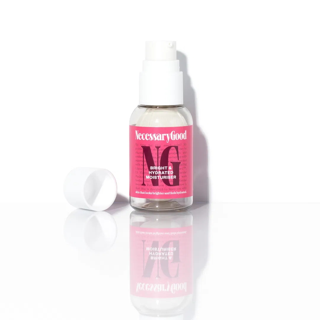 Bottle of Necessary Good Bright and Hydrated Moisturizer with its headdress off, showing the statement design