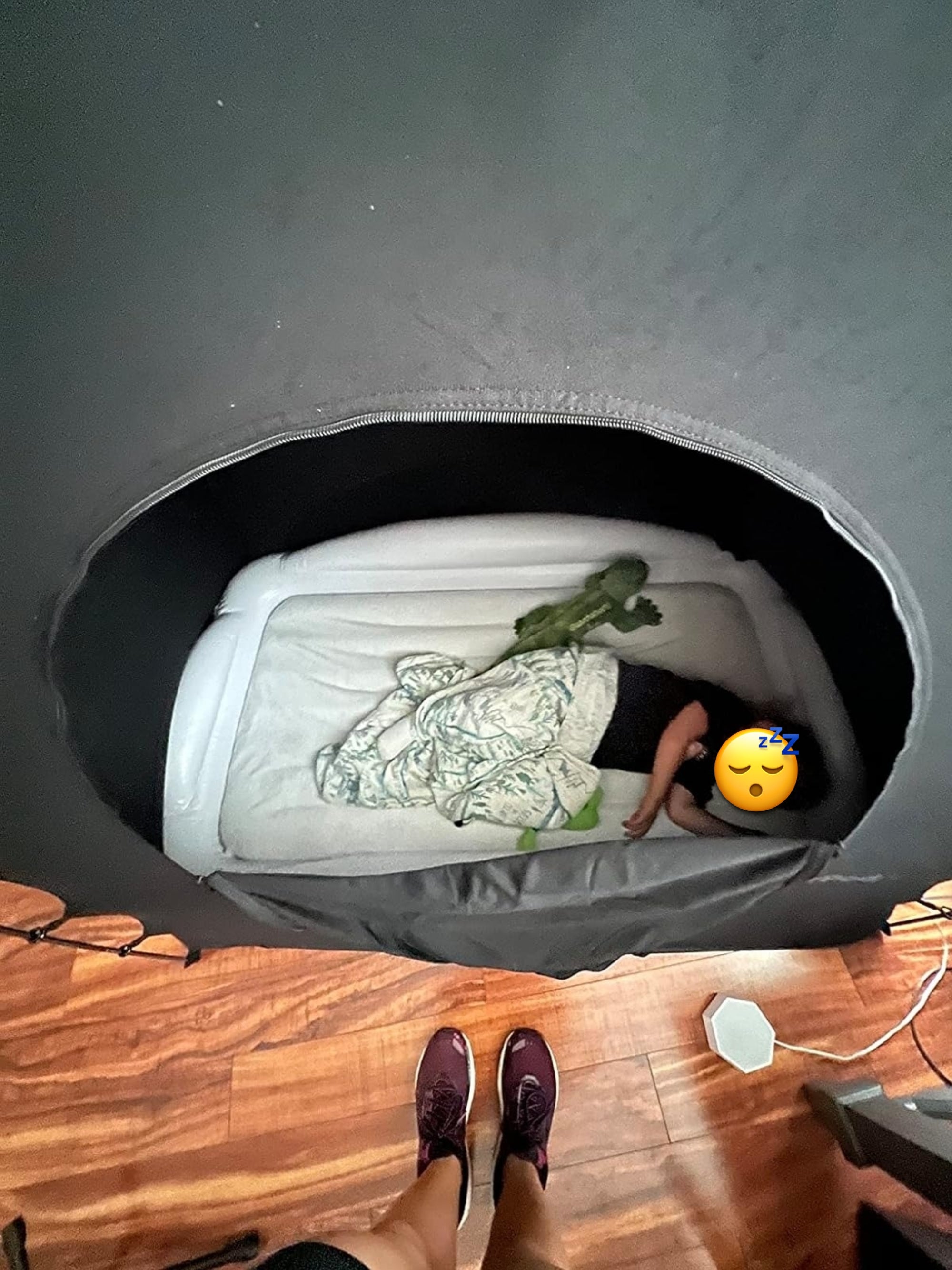 A kid  dormant  successful  the popular  up   tent