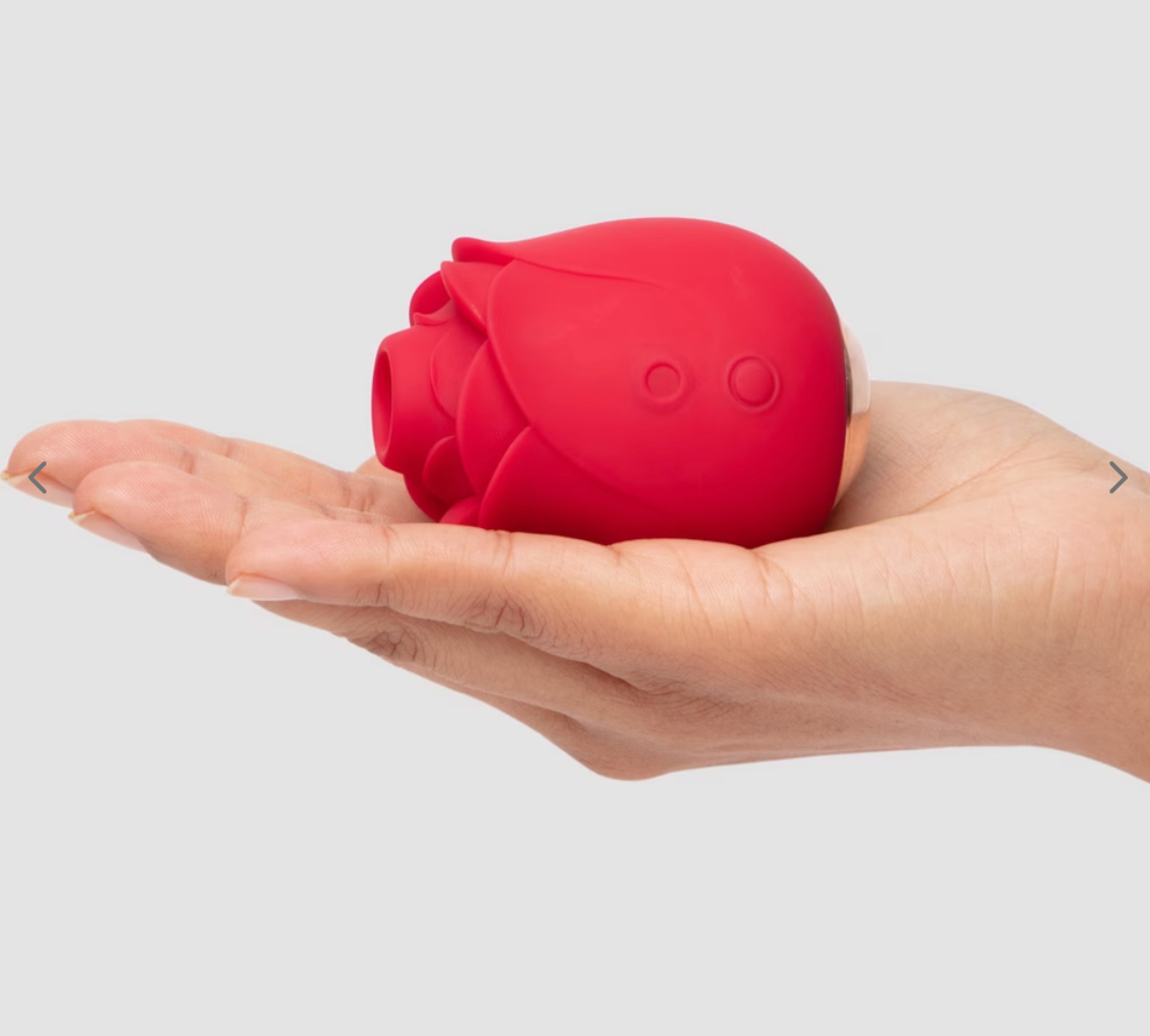 Person holding a rose-shaped point made of silicone successful their palm