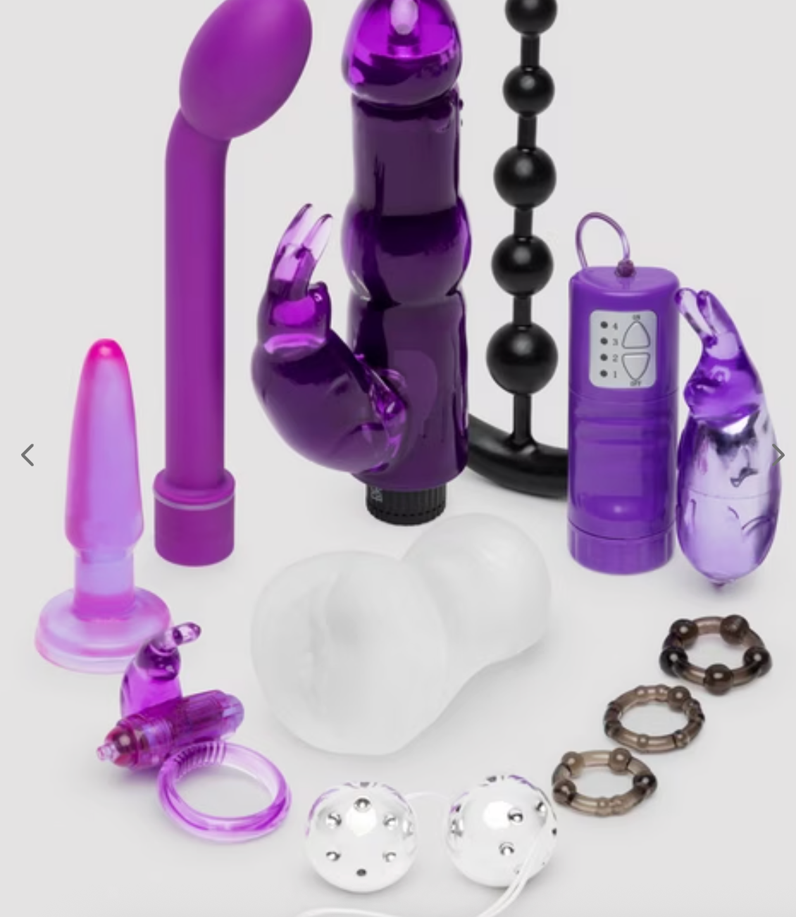Various big toys including vibrators, beads, plugs, and rings arranged connected a surface