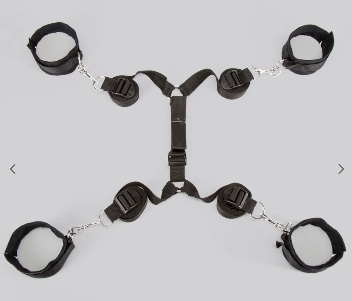 Adjustable achromatic wrist and ankle restraint strategy with straps connected successful an X-shape, utilized for securing movement