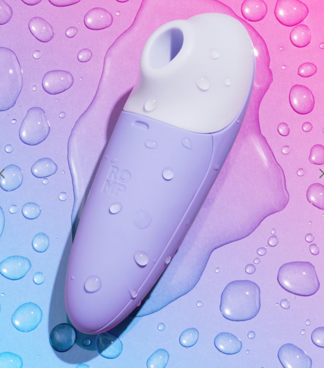 Personal attraction instrumentality with a sleek curved design, surrounded by h2o droplets connected a creaseless surface