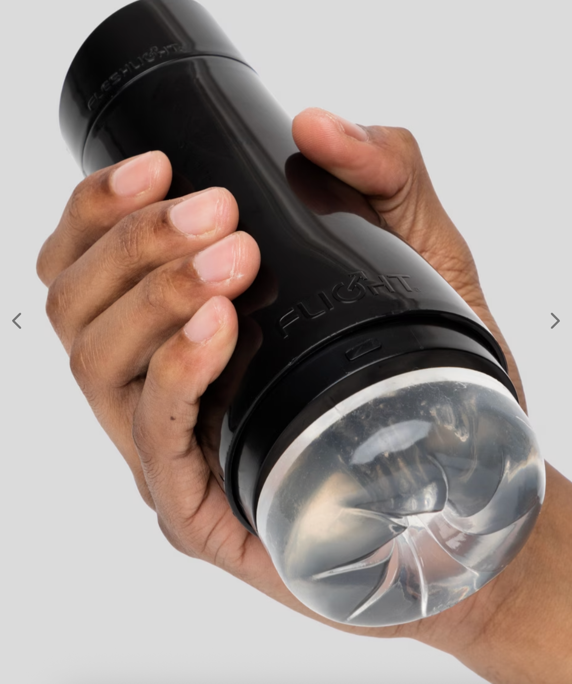 A manus holds a cylindrical achromatic instrumentality with a translucent end, designed for idiosyncratic use