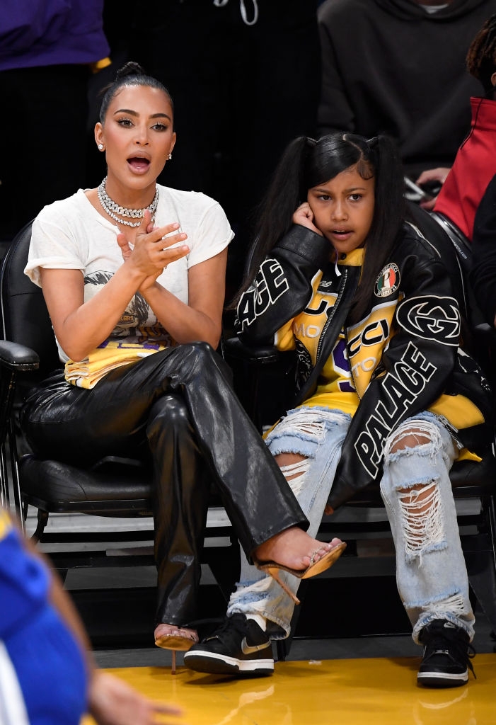 Kim with her girl North astatine a hoops game