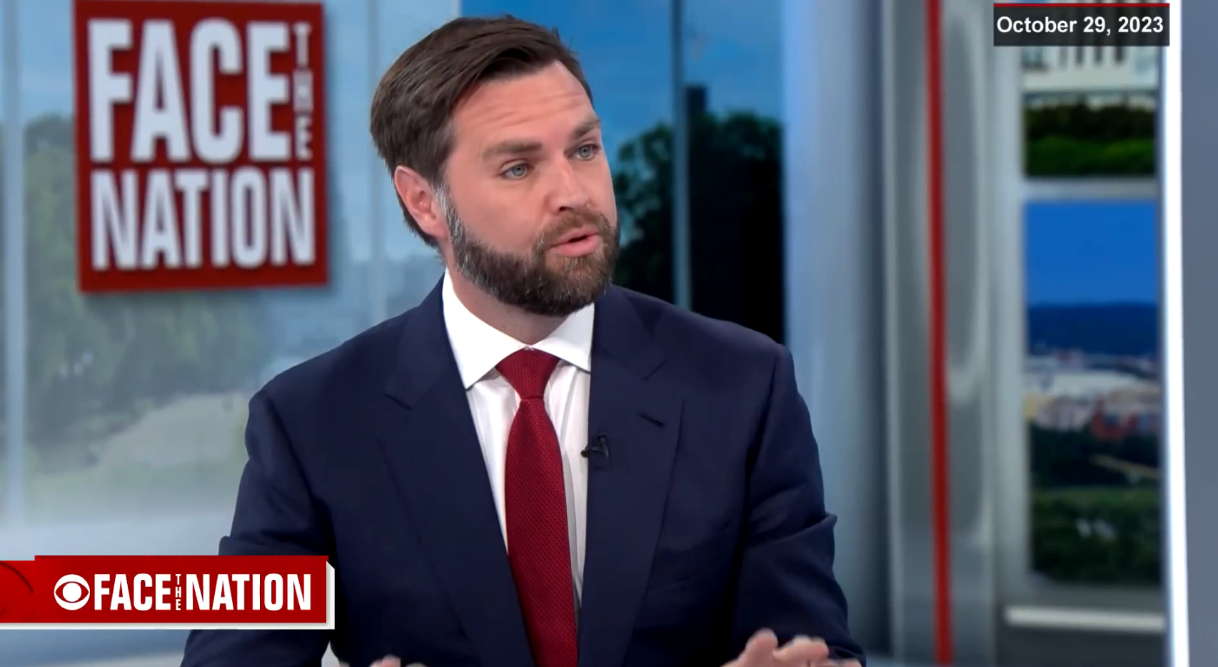 Man successful  a suit   discussing connected  a quality    amusement   with &quot;Face the Nation&quot; logo connected  screen, dated October 29, 2023