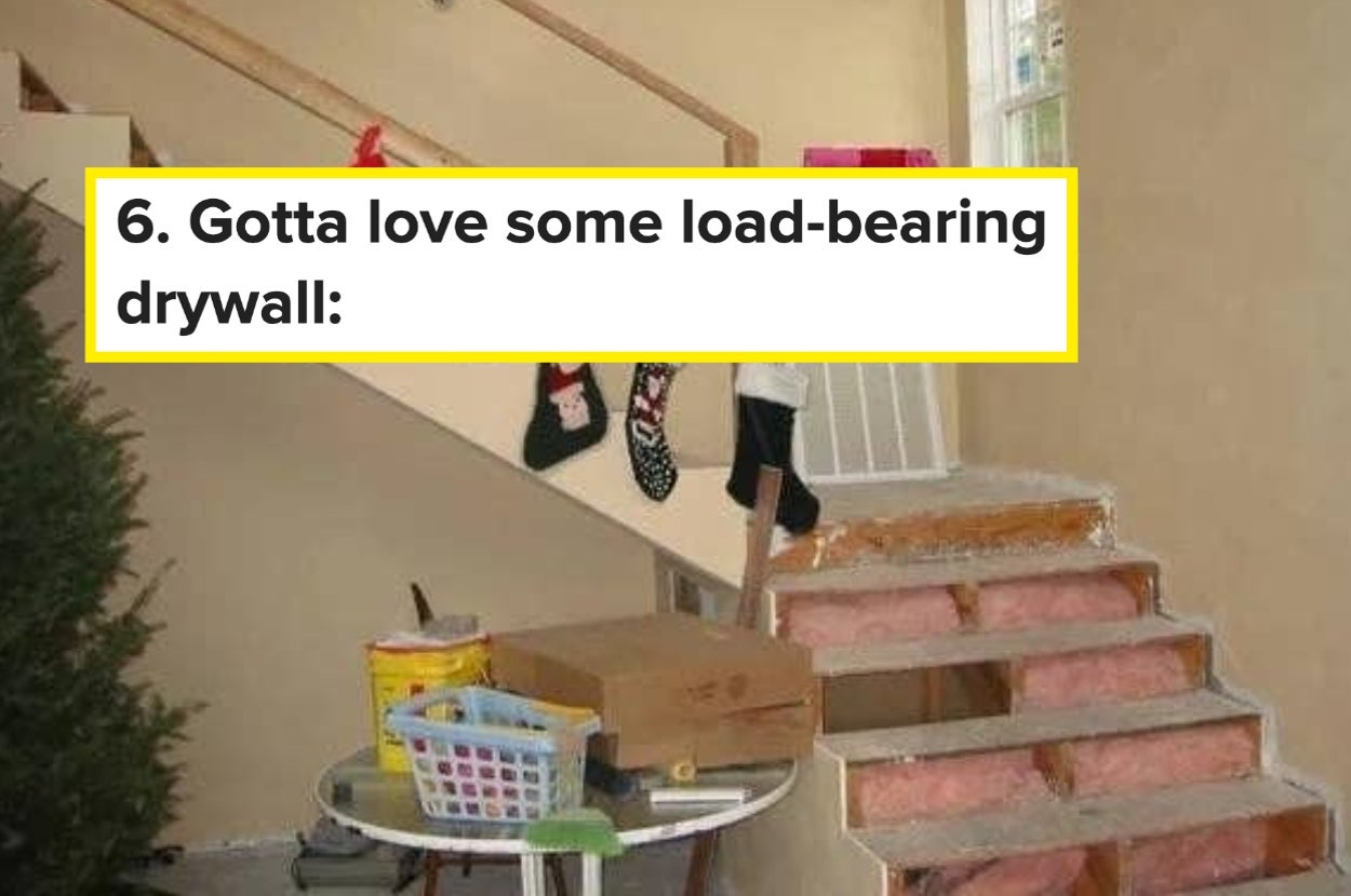 Humorous home scene: partially built staircase, exposed insulation, and a railing with a humorous comment about "load-bearing" drywall