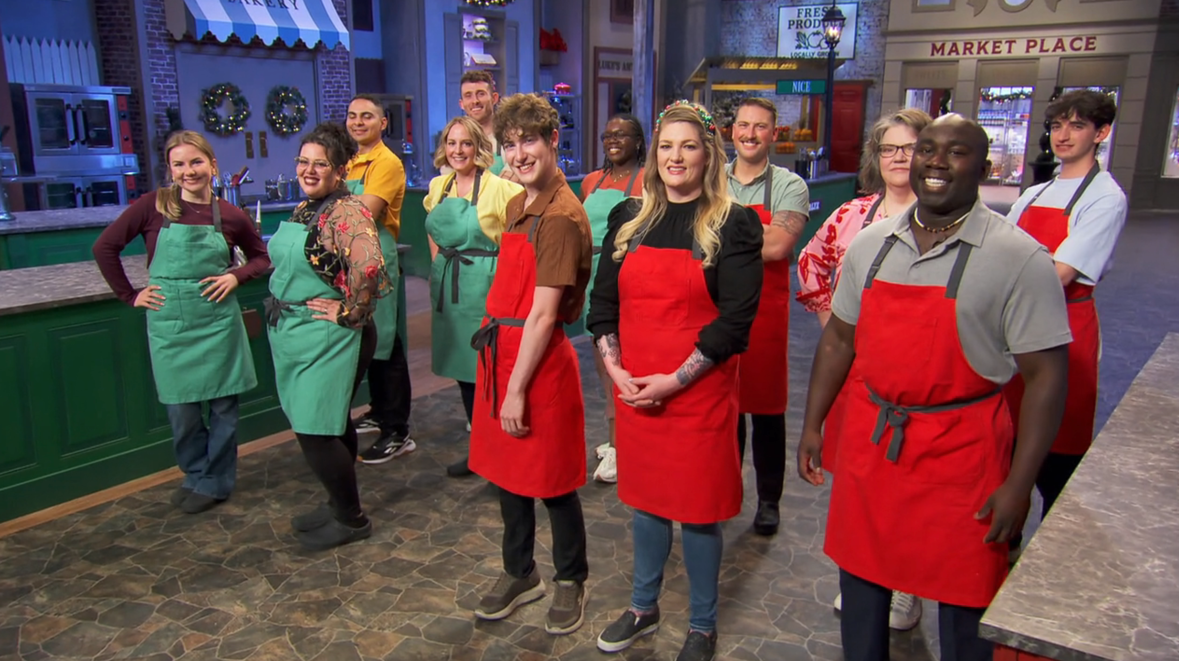 A radical  of radical   connected  a TV cooking set, wearing aprons and smiling