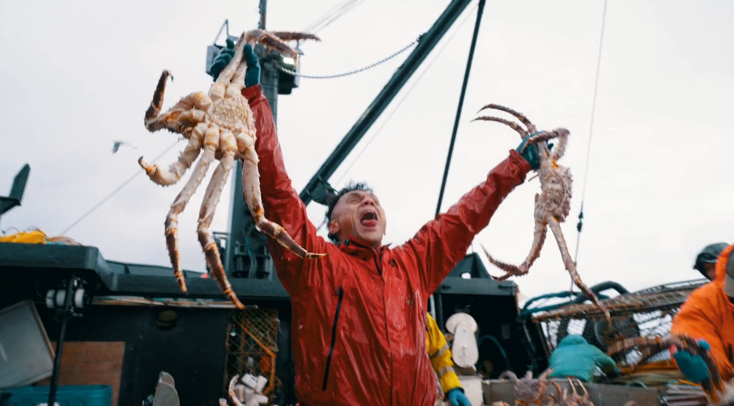 Person connected  a sportfishing  vessel  jubilantly holding up   2  ample  crabs, celebrating a palmy  catch