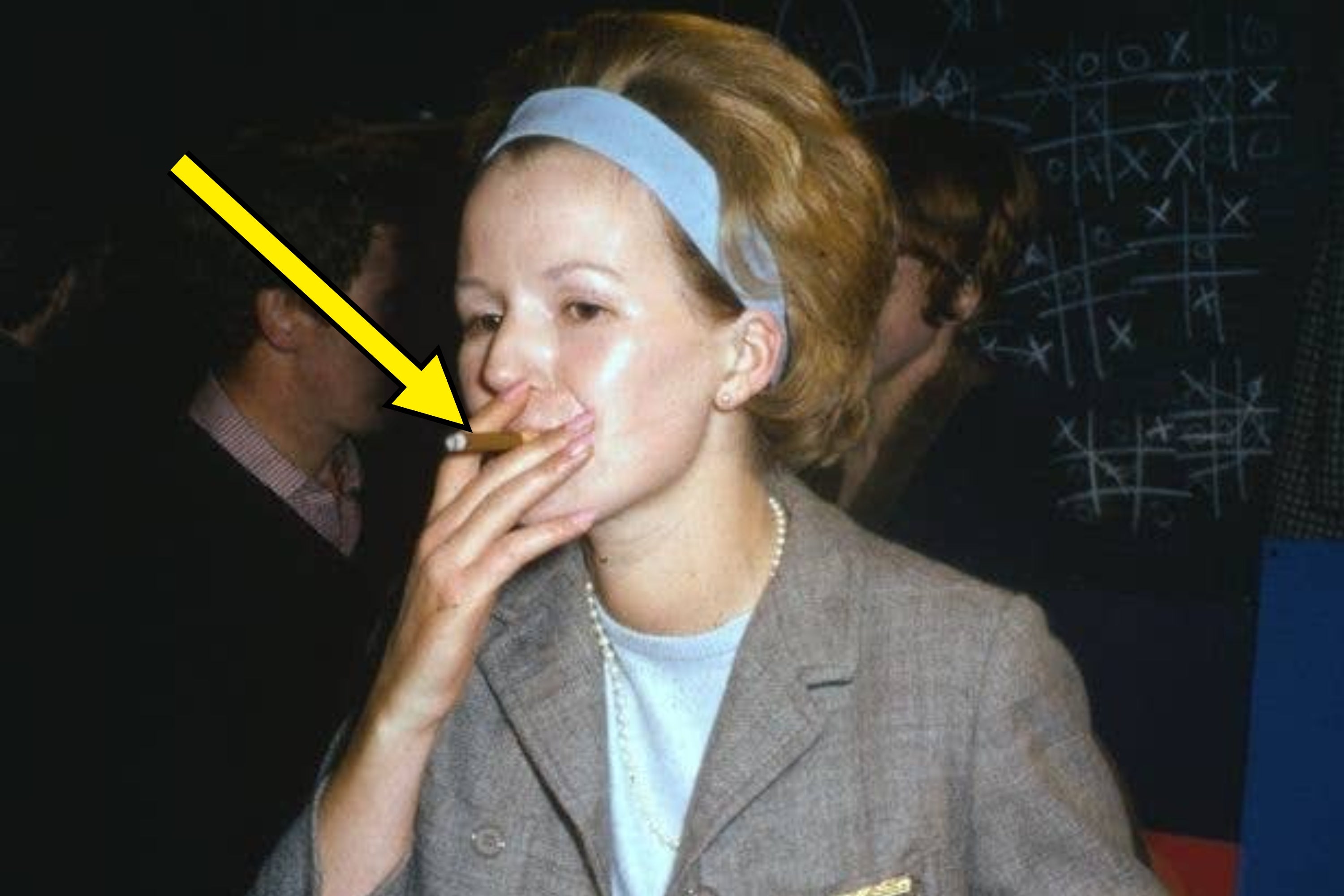 Woman smoking, wearing a headband and suit, standing in front of a tic-tac-toe board. Retro style. 