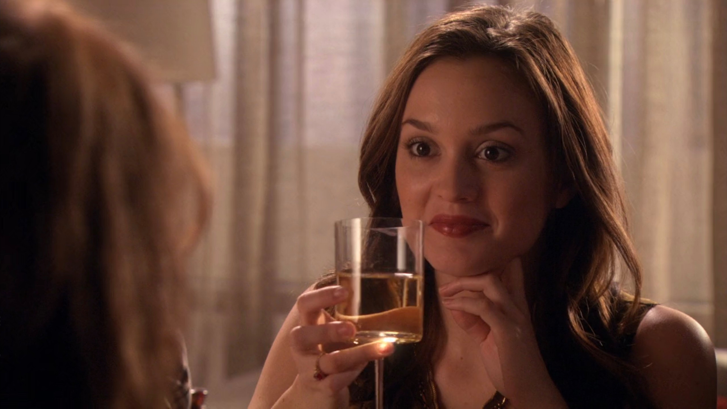 Blair holding a solid  of vino  and smiling astatine  her parent  pointedly