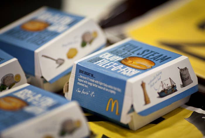 Closed McDonald&#x27;s Filet-O-Fish boxes connected  a table