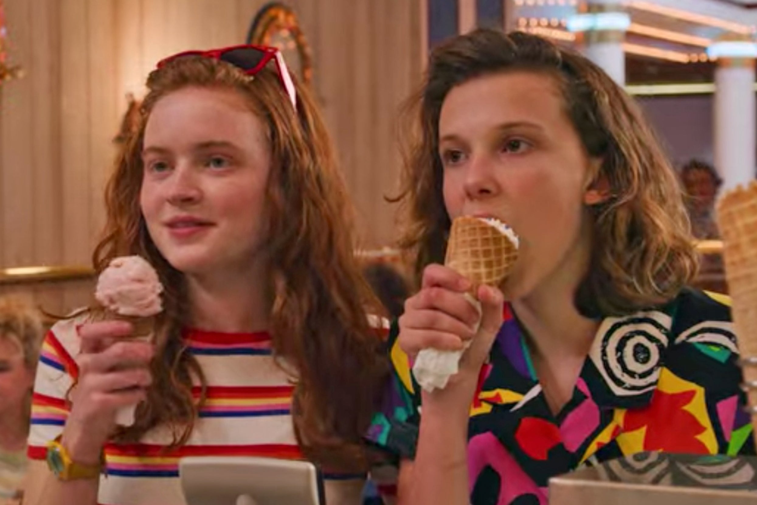 Max and Eleven from Stranger Things eating ice cream