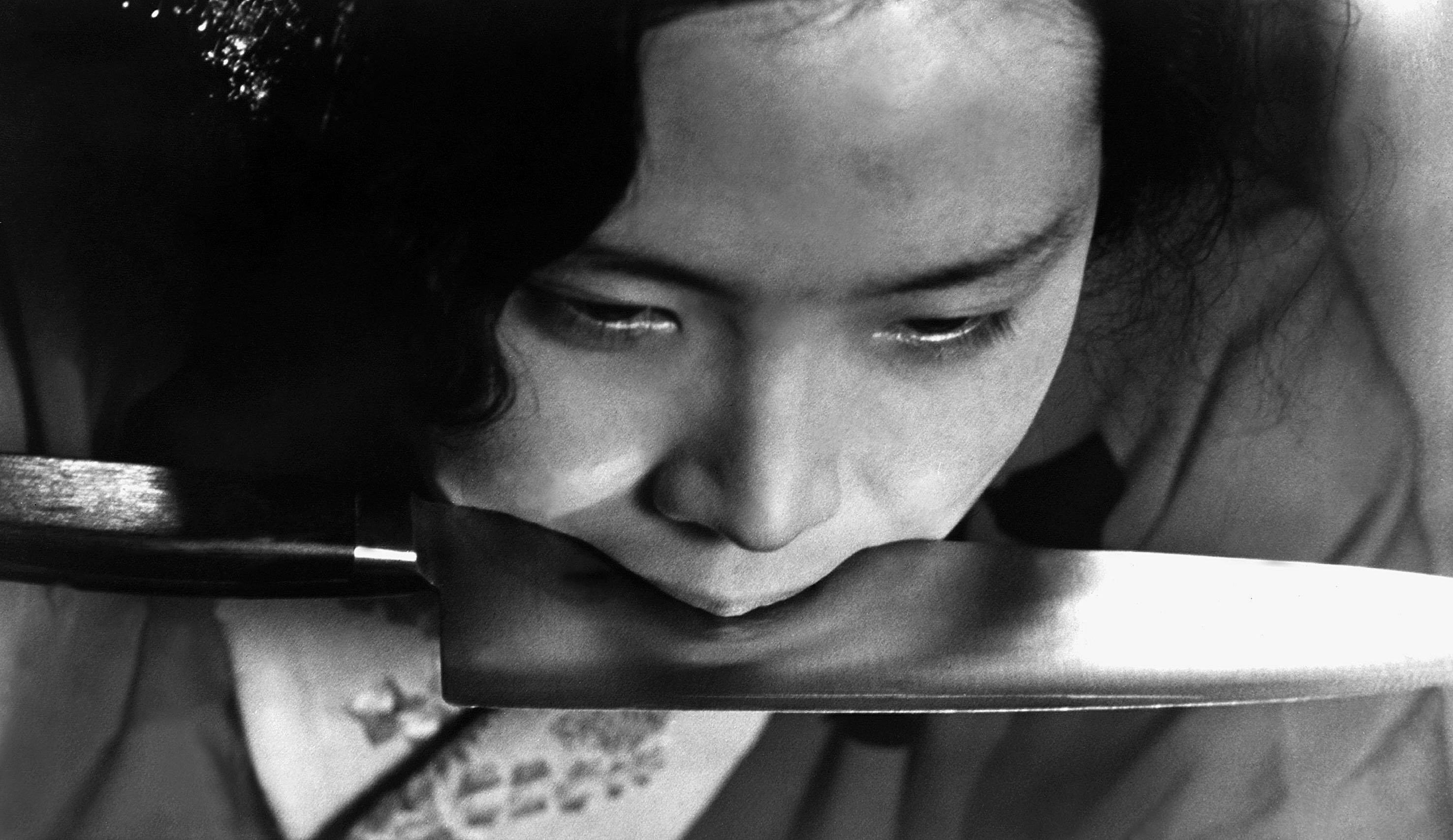 Person intently examining a knife&#x27;s leaf  adjacent  to their face, focusing connected  its edge