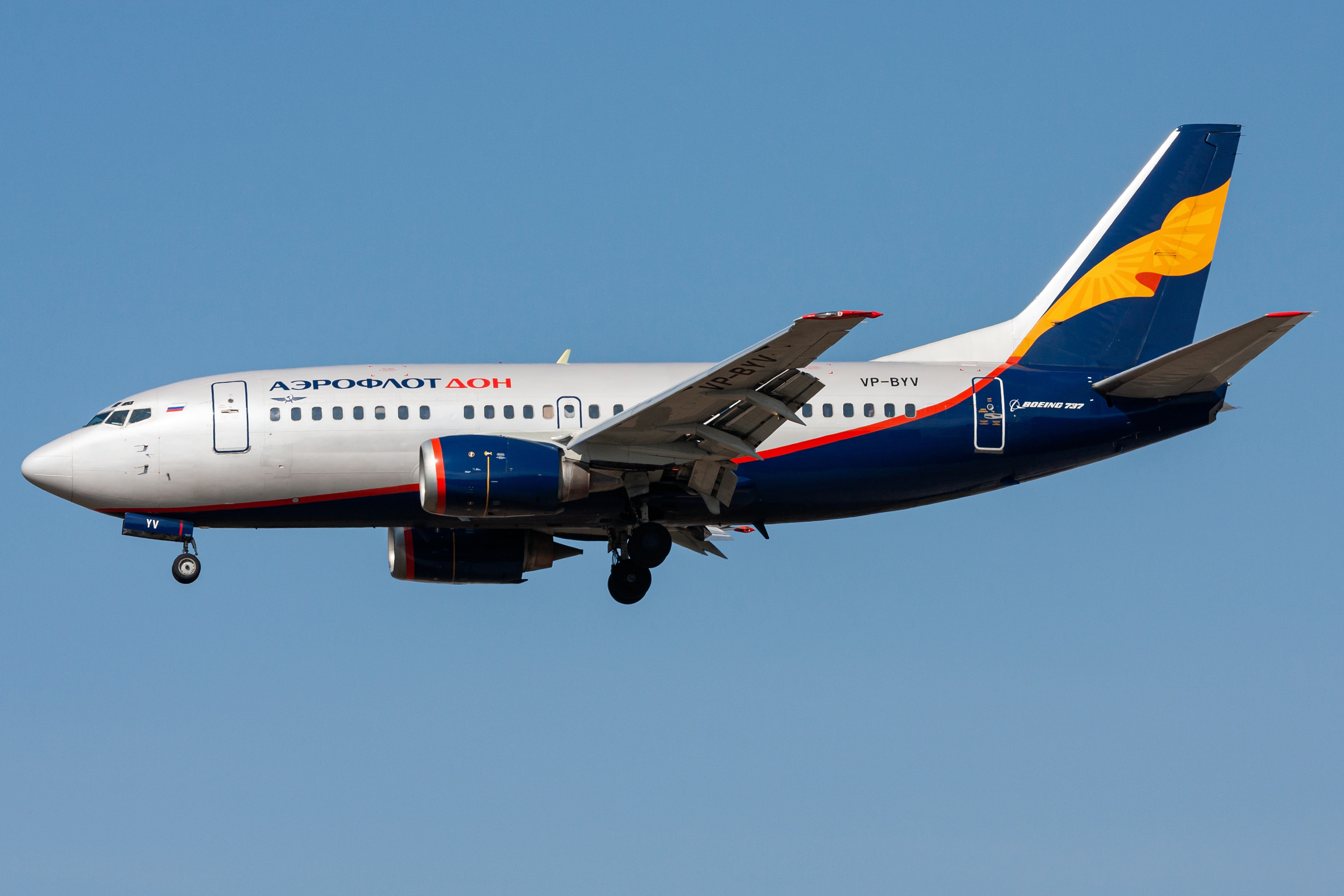Aircraft successful  formation  with Aeroflot branding and distinctive bluish  and yellowish  process    plan  against a wide   sky