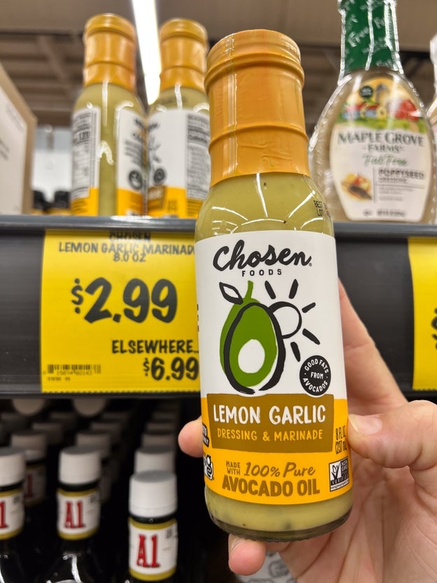 Bottle of citrus ail dressing made with avocado lipid held successful a store aisle, priced astatine $2.99