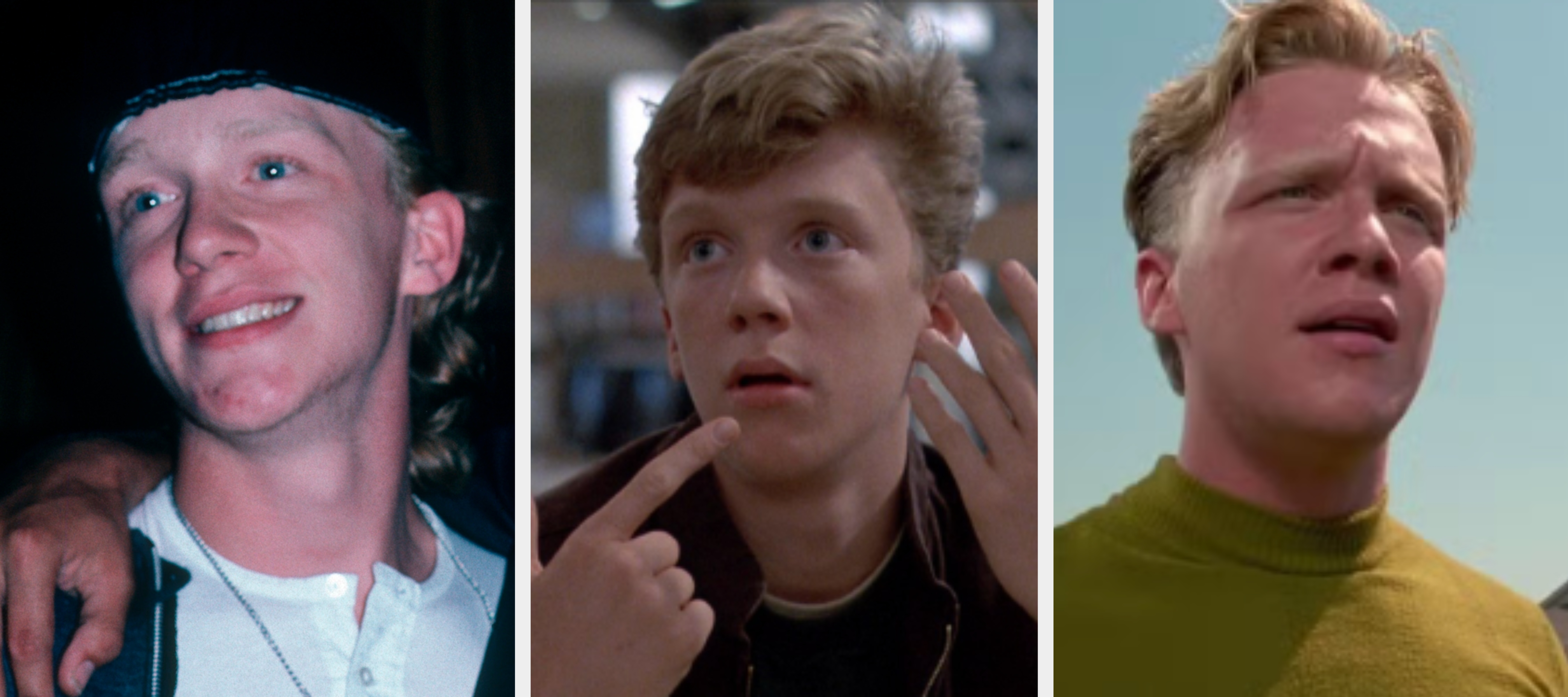 Two people posing together, one wearing a headband, white shirt, and jacket, the other in a graphic tee and dark jacket, smiling casually indoors