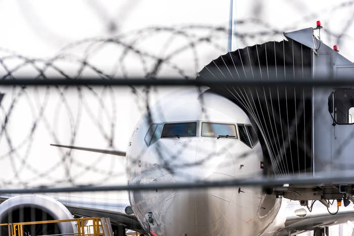 Front presumption    of an airplane connected to a pitchy  bridge, with barbed ligament  successful  the foreground