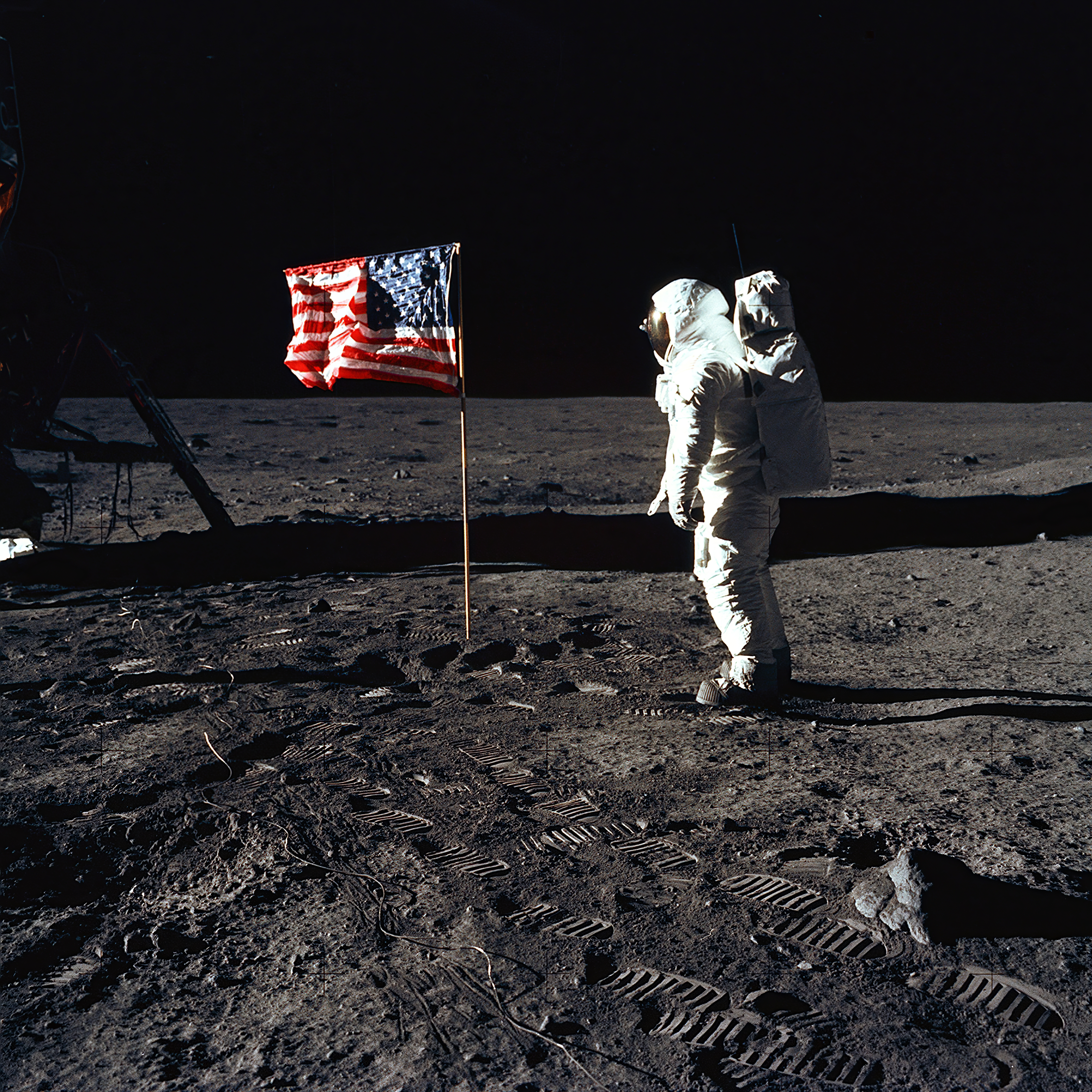 Astronauts successful  abstraction  suits adjacent  to a U.S. emblem  connected  the Moon, with the lunar module disposable   successful  the background