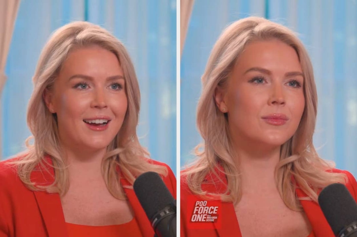 Person speaking into a microphone during an interview, wearing a stylish blazer and top, with a focused expression and natural backdrop