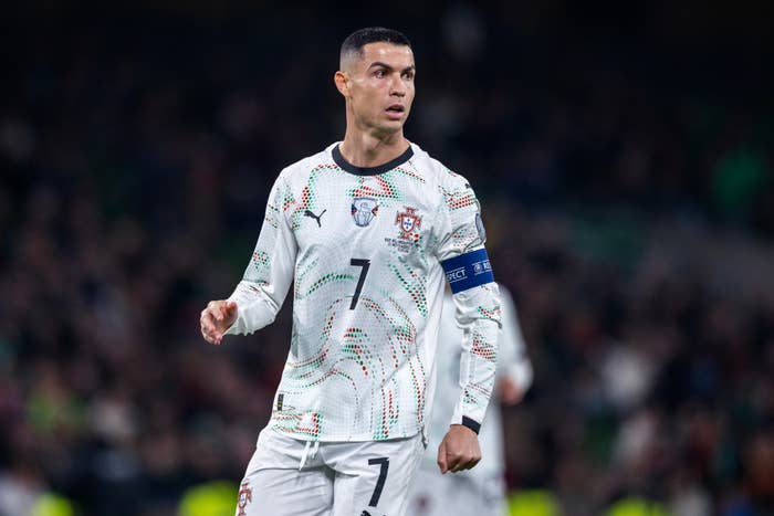 Soccer subordinate    successful  a Portugal jersey connected  a field, wearing a captain&#x27;s armband