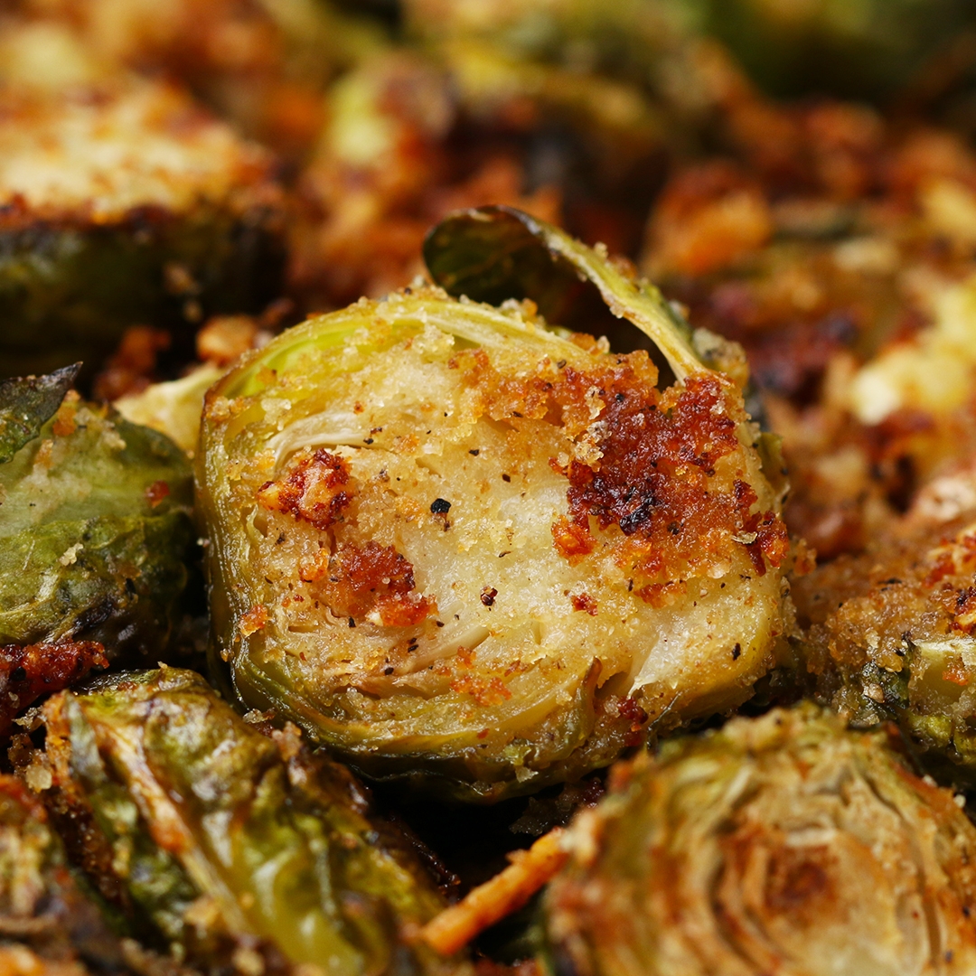 Close-up of roasted Brussels sprouts with a golden-brown crust, showcasing a crispy and savory texture