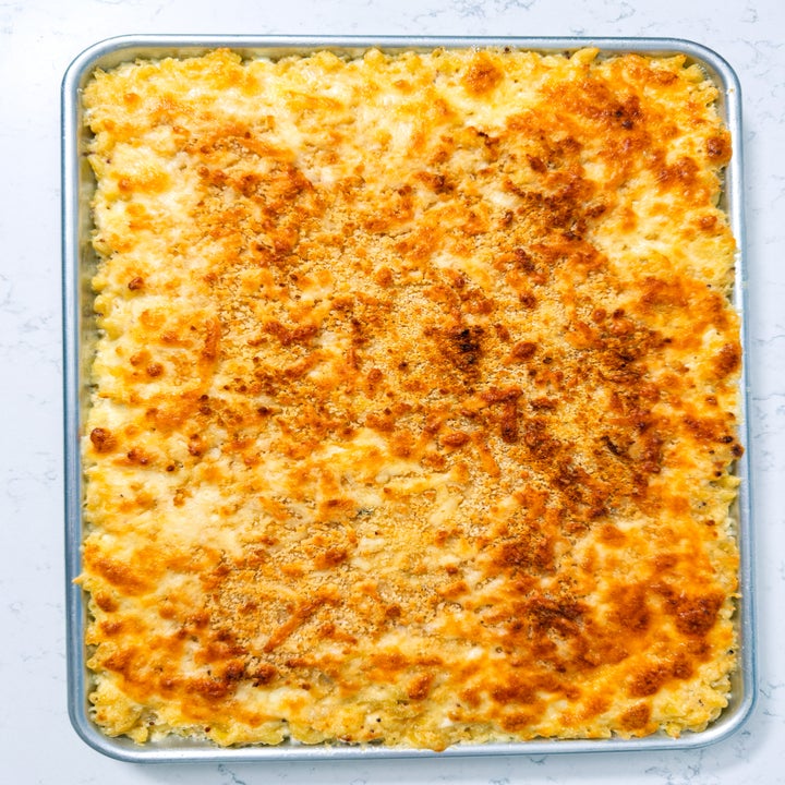 Baked macaroni and cheese in a rectangular pan, with a crispy, golden-brown crust on top