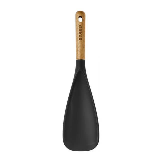 A Staub spatula with a woody handle, perfect for nonstick cookware, suitable for mundane cooking tasks